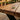 Close-up of handmade solid wood bench seating in a hospitality venue, premium commercial bench for pub, restaurant, cafe and beer garden seating UK